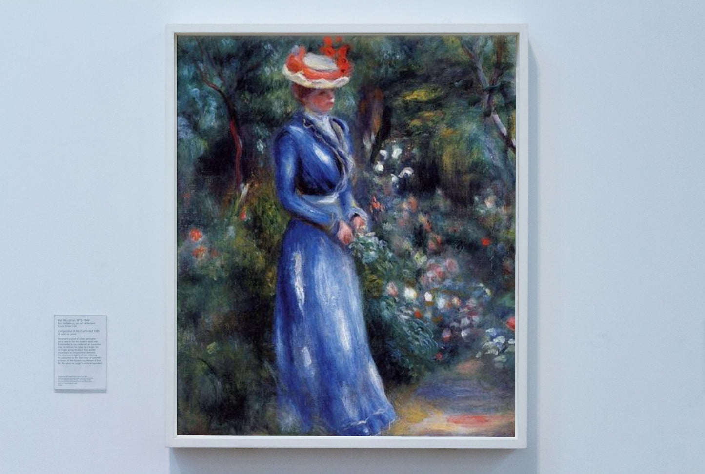 Woman in a Blue Dress, Standing in the Garden of Saint Cloud by Pierre-Auguste Renoir Impressionism Art dated 1899